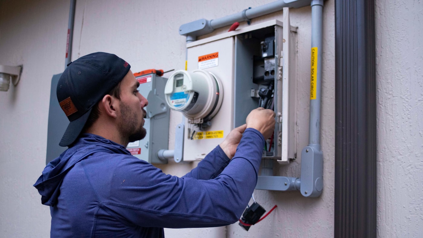 Coquina Air technician servicing an HVAC unit